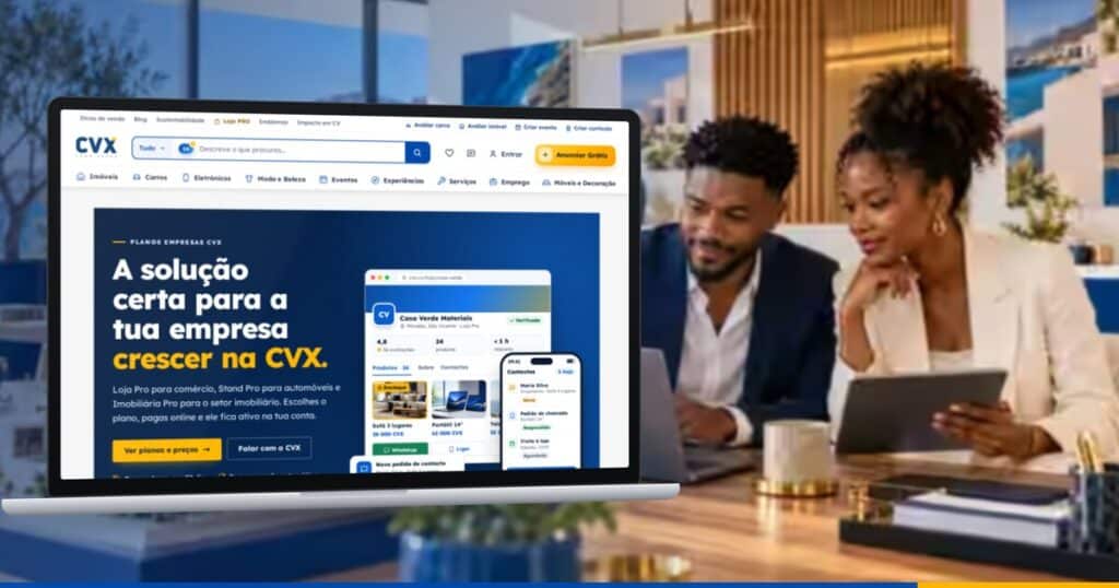 Portátil com a página Planos Empresas da CVX, num escritório onde dois profissionais trabalham com portátil e tablet